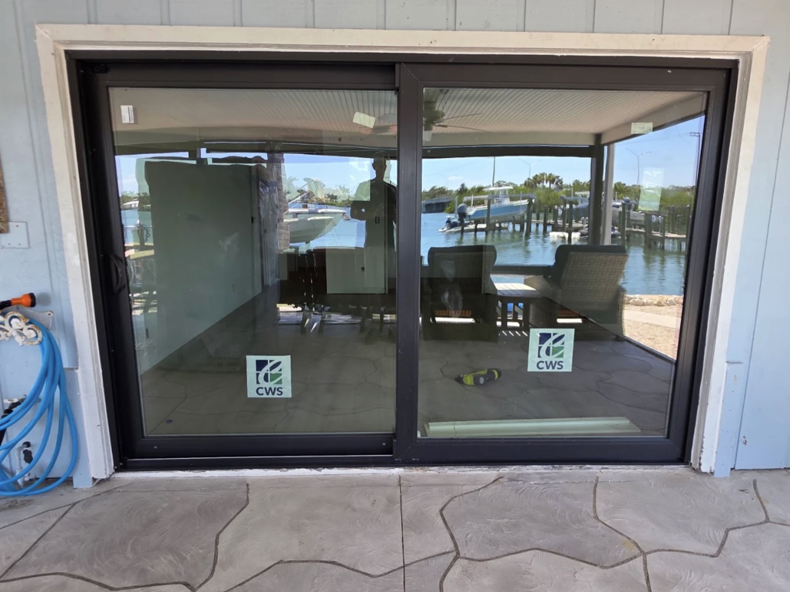 Impact-rated sliding glass door installed on a Fort Myers waterfront home